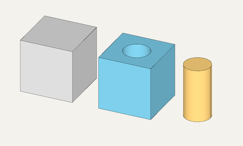 Original cube on the left, part with a hole in the center, cylindrical core on the right